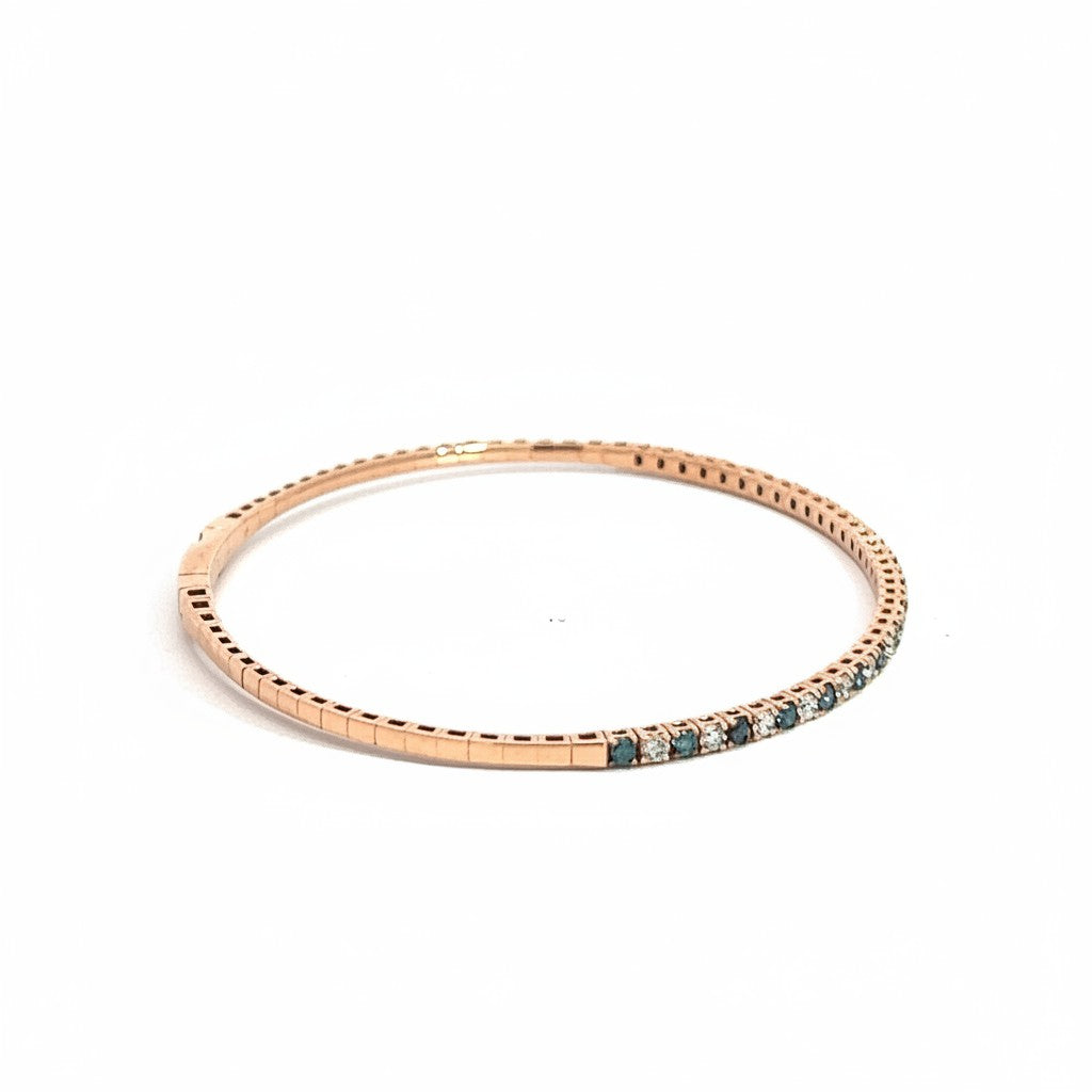 Caribbean Gems ladies rose gold bangle featuring a delicate row of alternating blue and white diamonds