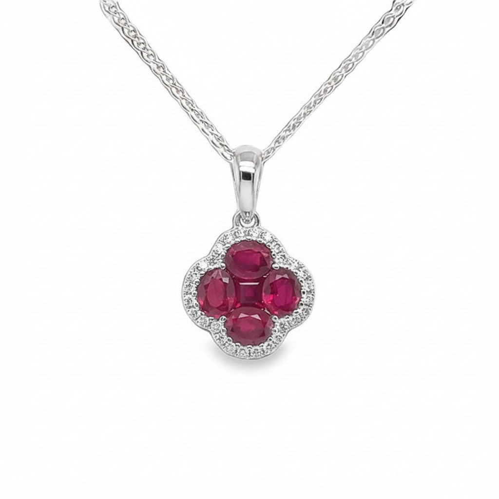 Caribbean Gems 14kt white gold necklace with oval rubies and round diamond halo in a clover-shaped pendant design.