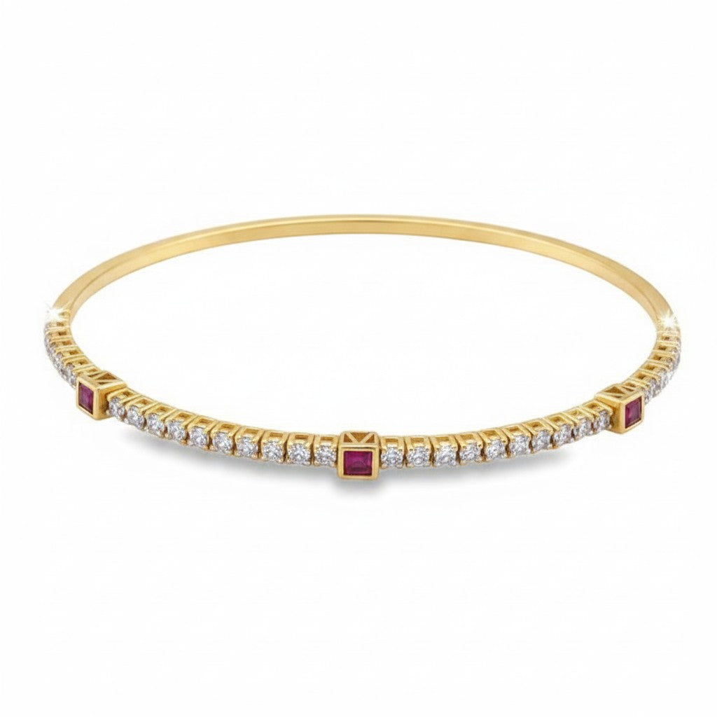 Caribbean Gems flexible 14kt yellow gold bangle featuring square cut rubies and round diamonds