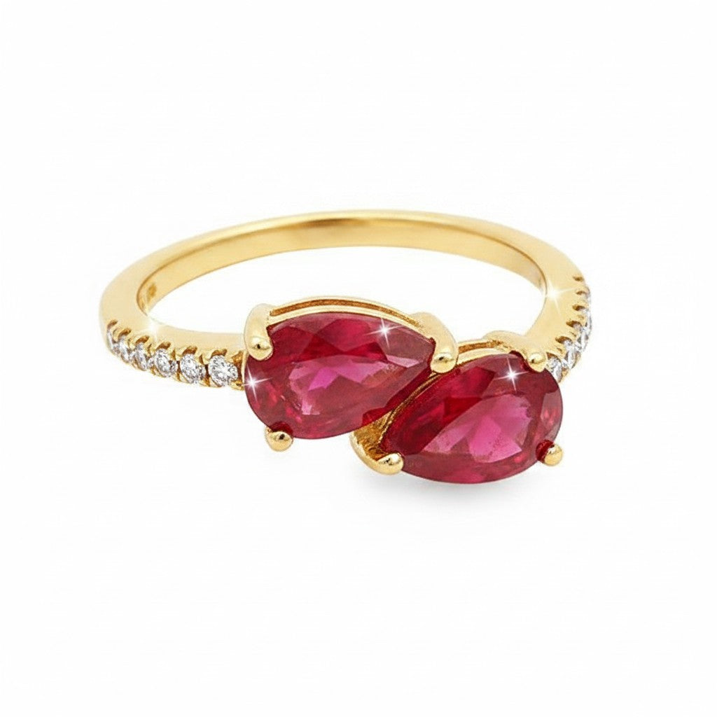Caribbean Gems 14kt yellow gold ring featuring two pear-shaped rubies and round diamond accents on the band.
