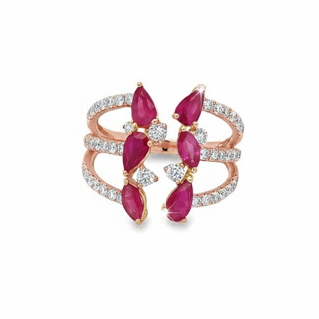 Caribbean Gems 14kt rose gold ring featuring pear-shaped rubies and round brilliant diamonds in an open bypass design.