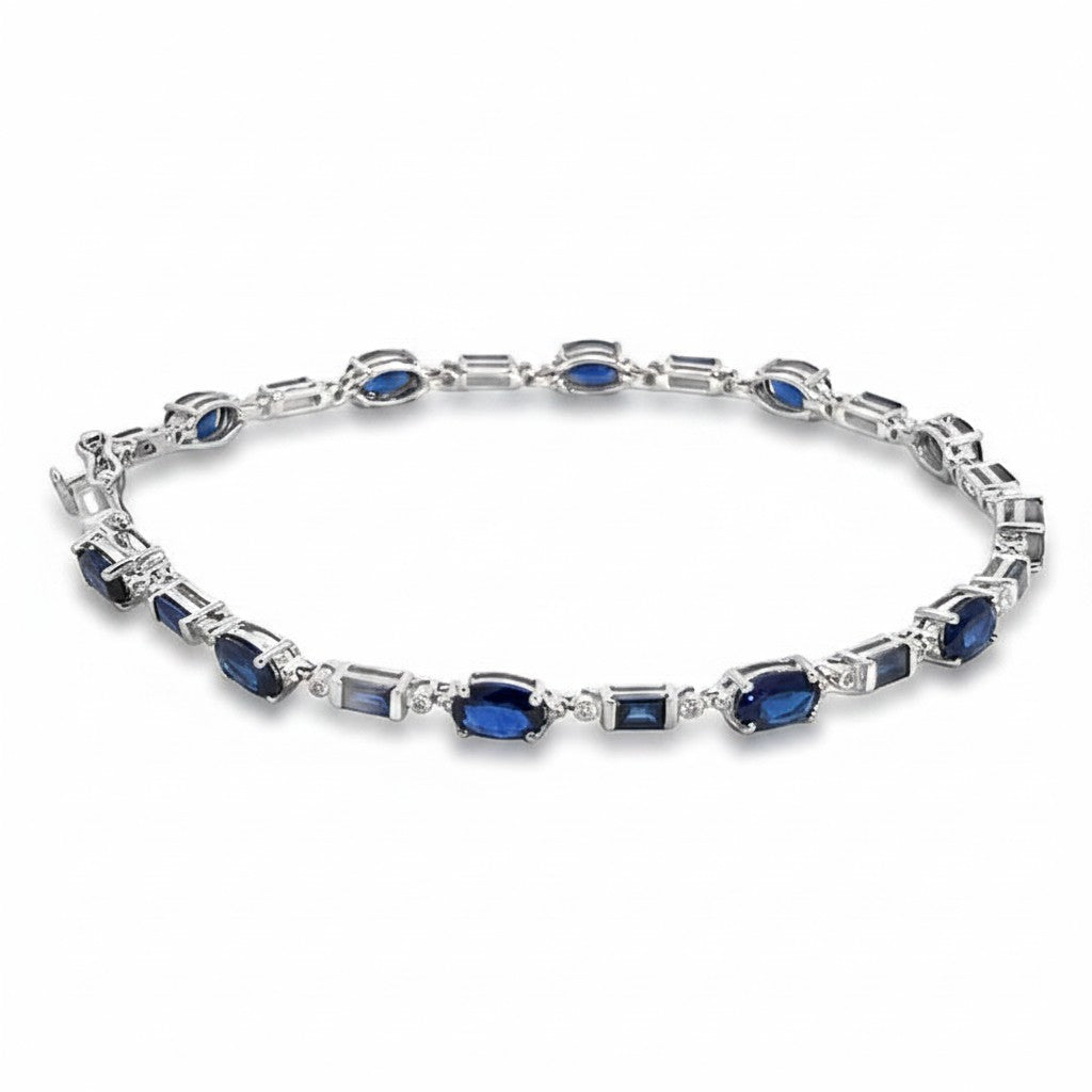 Caribbean Gems 14kt white gold bracelet featuring oval and emerald-cut blue sapphires with round diamond accents.