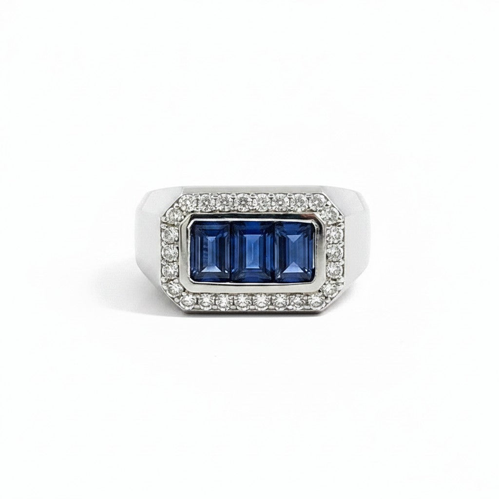 Caribbean Gems men's ring featuring three baguette-cut blue sapphires surrounded by a halo of round brilliant diamonds.