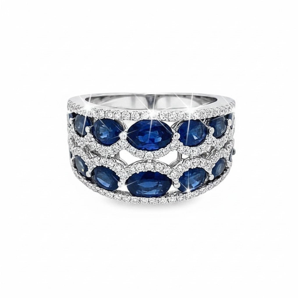 Caribbean Gems oval sapphire and round diamond ring set in 14kt white gold with a multi-row band design.