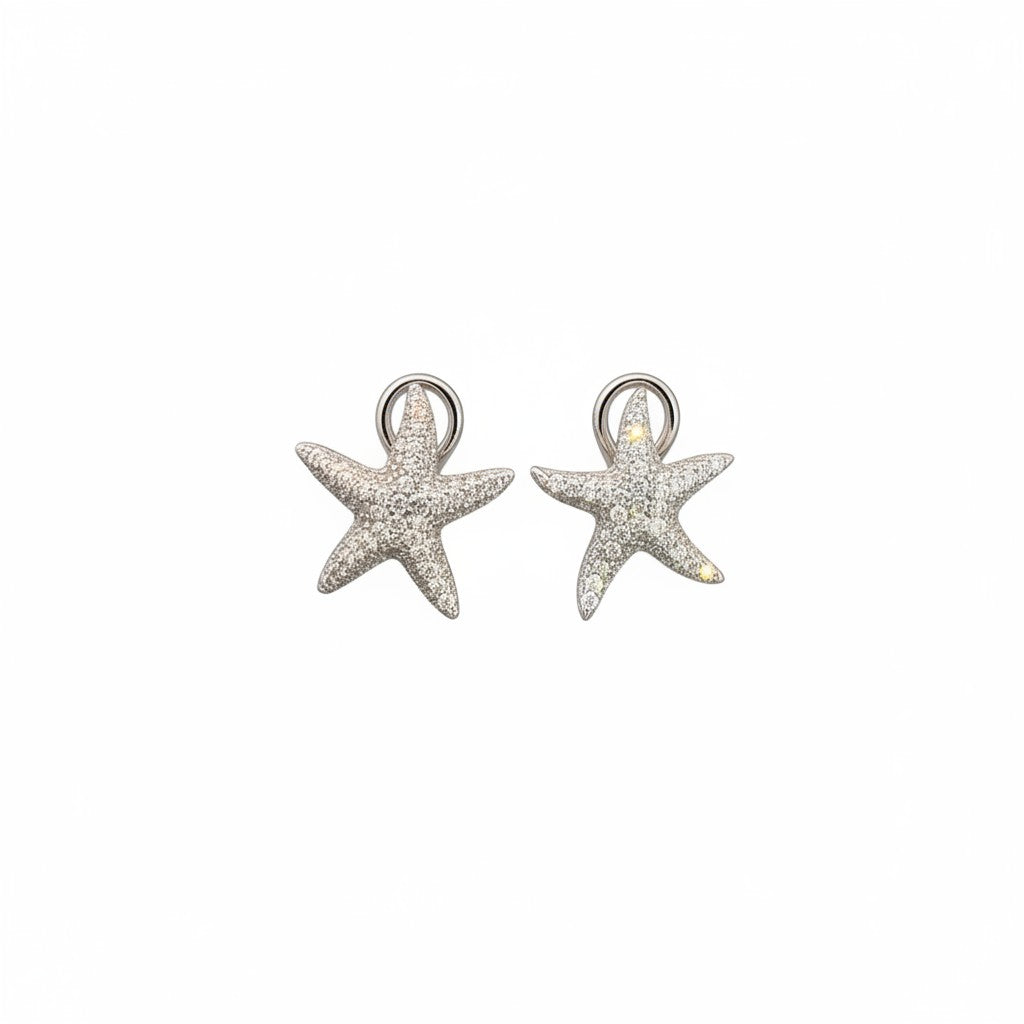 Caribbean Gems 14k gold starfish earrings encrusted with sparkling white diamonds on a clean white background