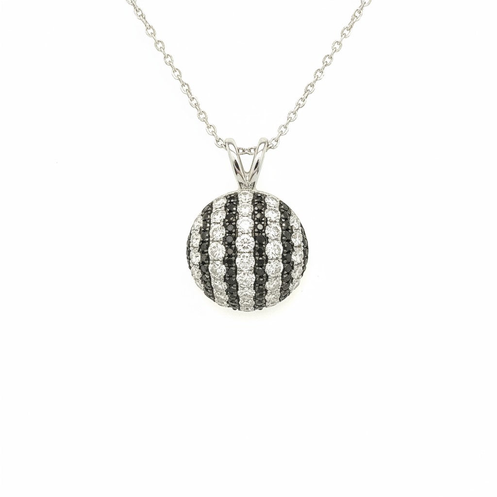 Caribbean Gems round pendant featuring alternating stripes of white and black diamonds set in 18kt white gold