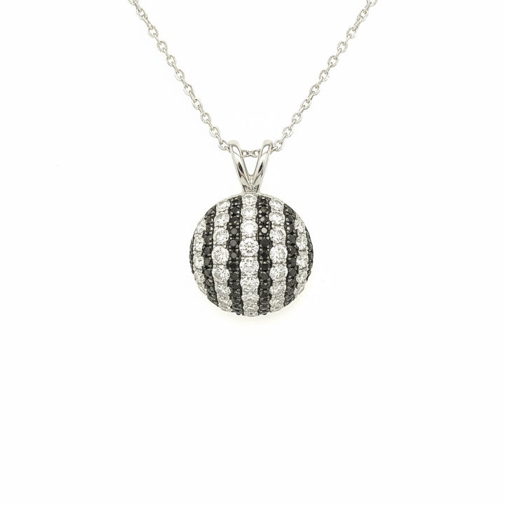 Caribbean Gems round pendant featuring alternating stripes of white and black diamonds set in 18kt white gold