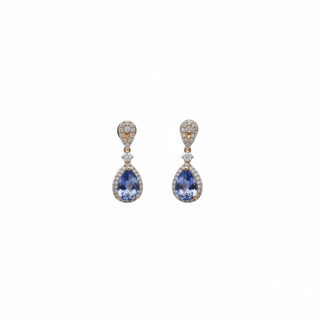 Caribbean Gems ornate drop earrings with pear-cut tanzanite and diamond accents set in 18kt yellow gold