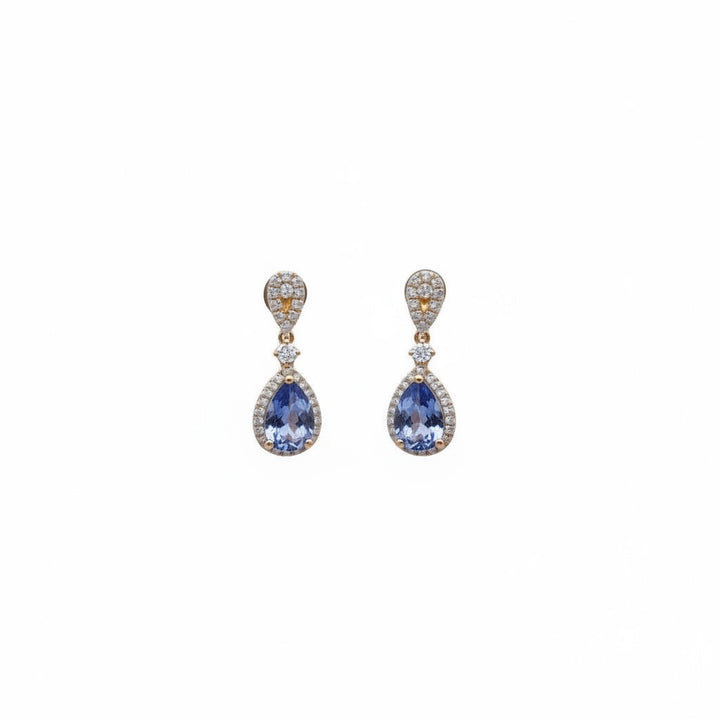 Caribbean Gems ornate drop earrings with pear-cut tanzanite and diamond accents set in 18kt yellow gold