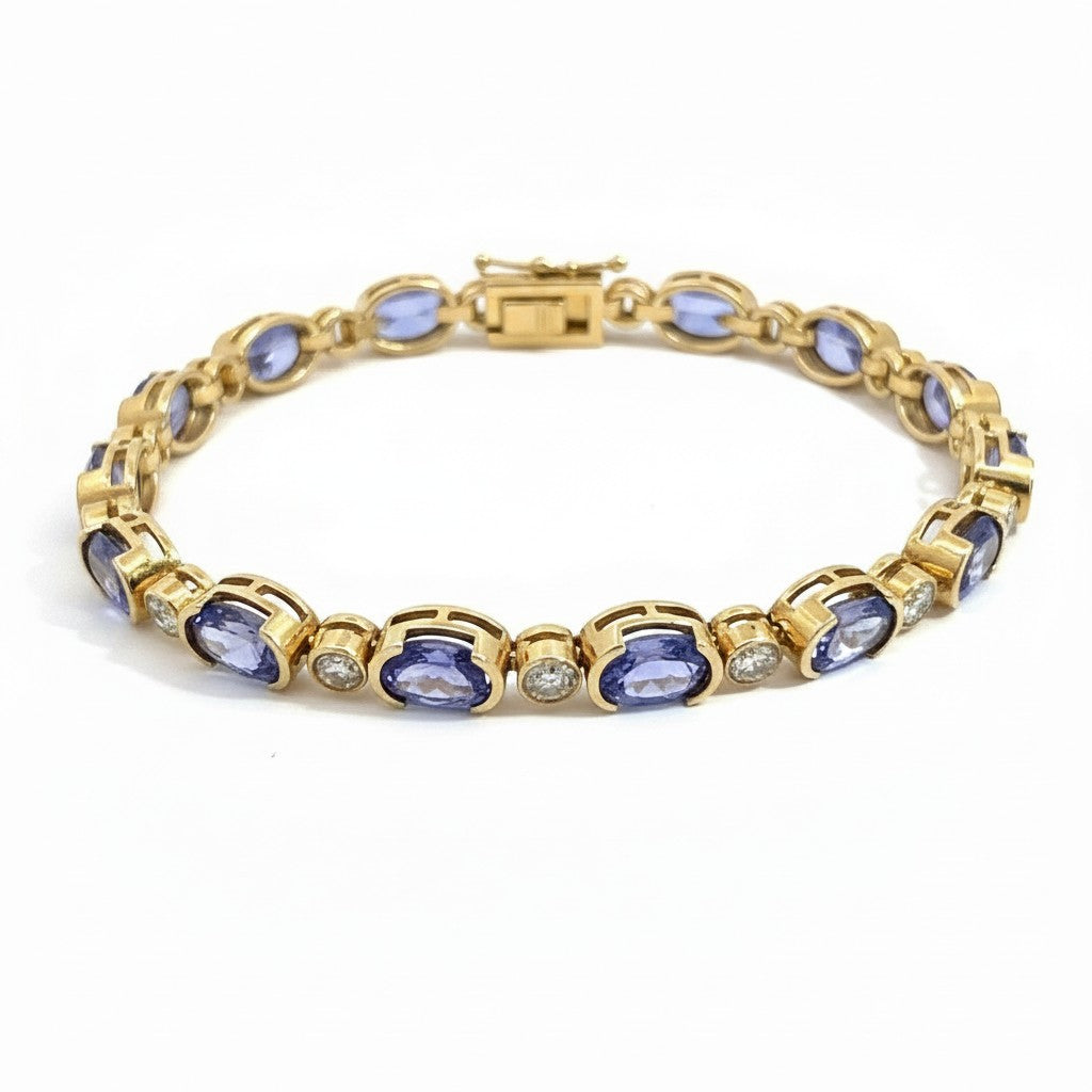 Caribbean Gems 14kt yellow gold bracelet featuring oval tanzanite stones and round diamonds in a link design.