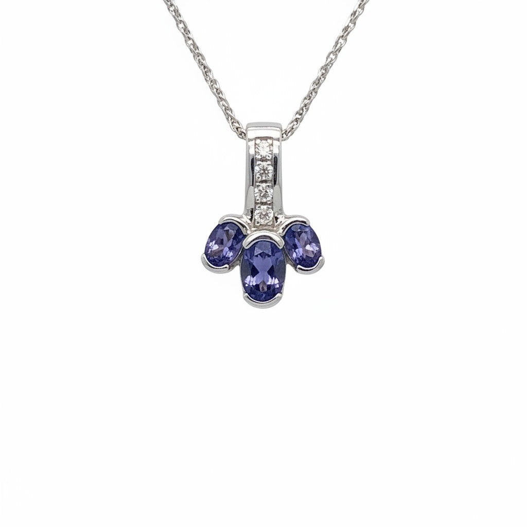 Caribbean Gems 14kt white gold pendant featuring three oval tanzanite stones and round diamond accents on a chain.