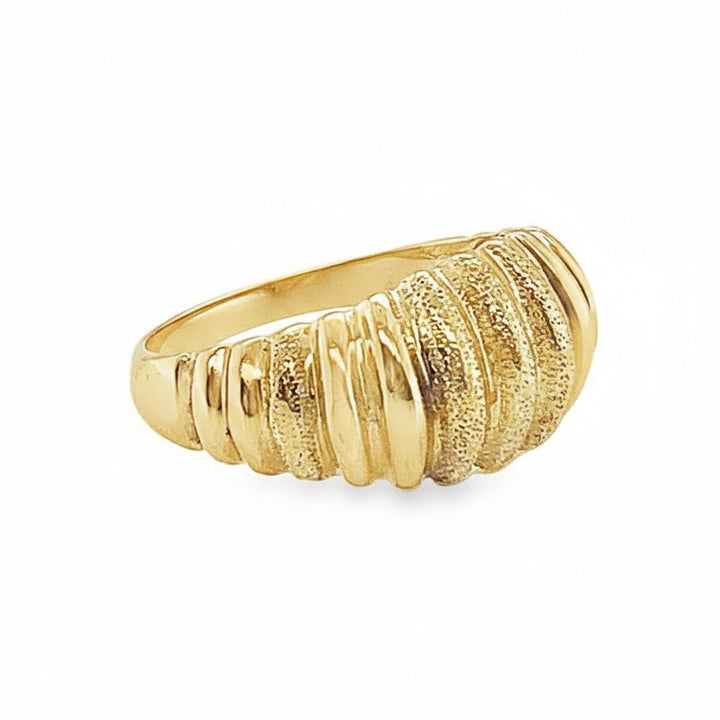 Caribbean Gems elegant gold ring featuring a textured ridged design that reflects light on a white background.
