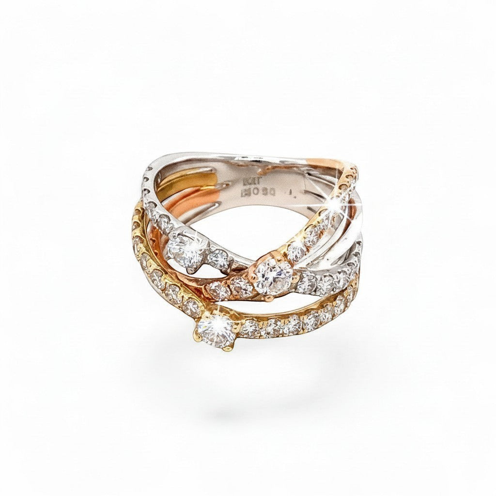 Caribbean Gems 14kt tri-color gold crossover ring featuring 2.17cts of sparkling round cut diamonds.
