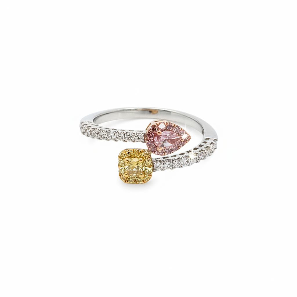 Caribbean Gems tri-color gold ring featuring a yellow cushion-cut diamond, pink pear-cut diamond, and white diamonds.