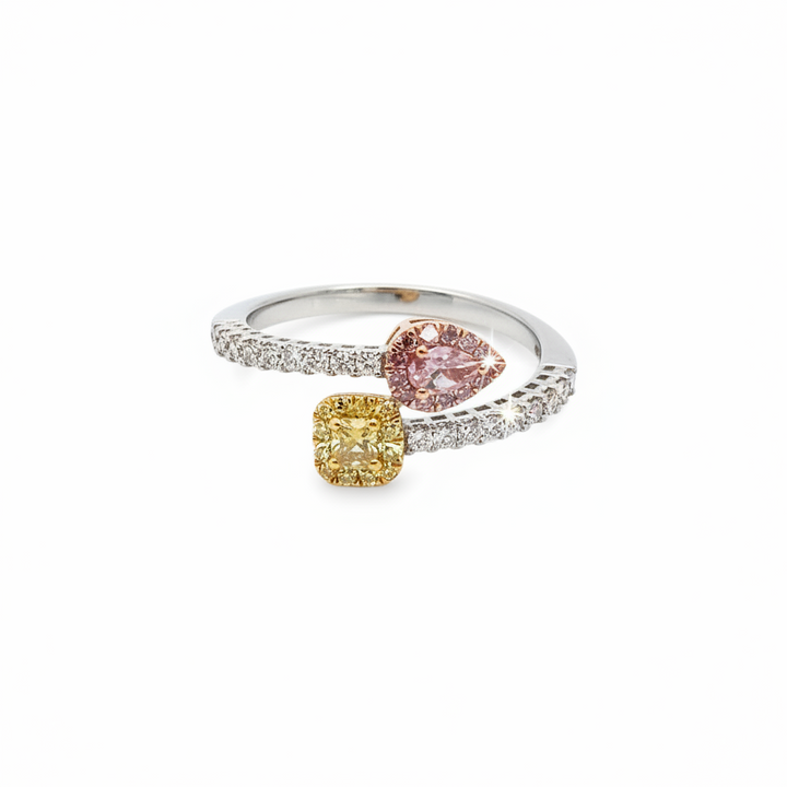 Caribbean Gems tri-color gold ring featuring a yellow cushion-cut diamond, pink pear-cut diamond, and white diamonds.