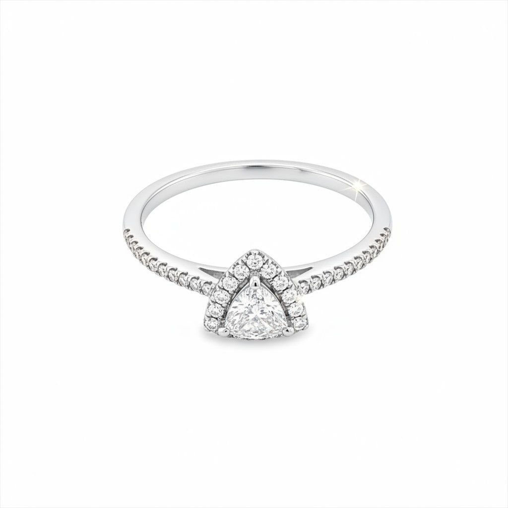 Caribbean Gems 14kt white gold ring featuring a trillion cut center diamond and round diamond halo and band.