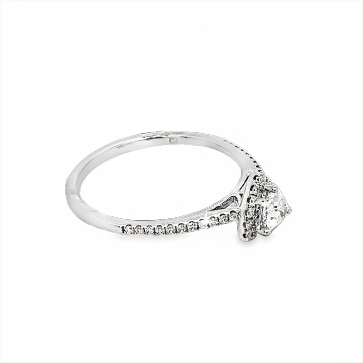 Caribbean Gems 14kt white gold ring featuring a trillion cut center diamond and round diamond accents on the band.