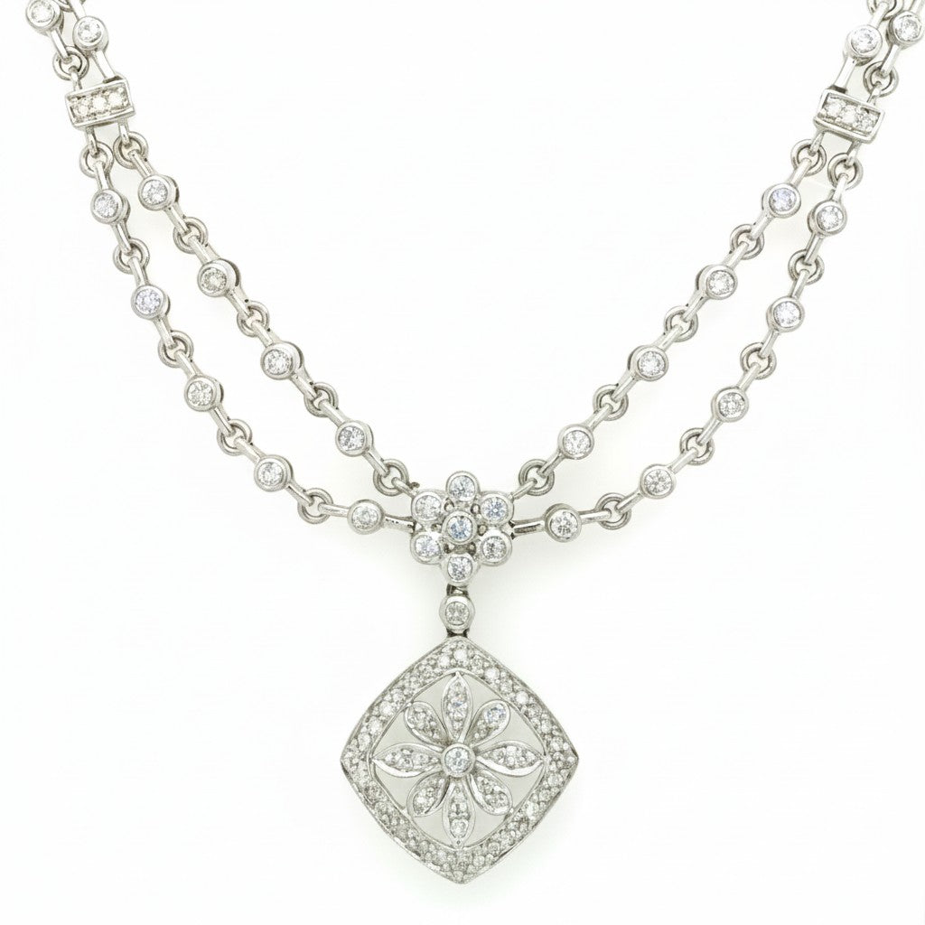 Caribbean Gems 14kt white gold diamond necklace featuring a double chain and a floral diamond pendant.