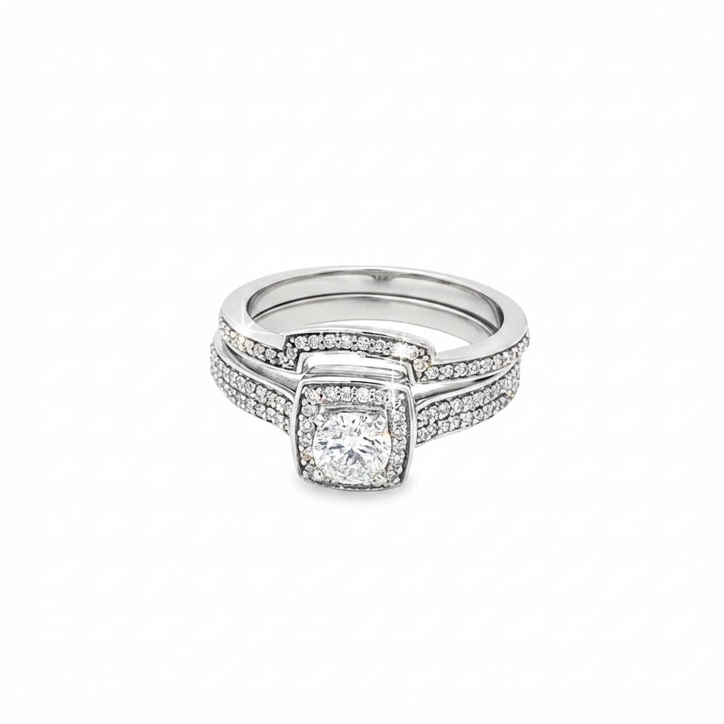 Caribbean Gems 14kt white gold diamond bridal ring set featuring a 0.31ct round cut center stone and diamond accents.