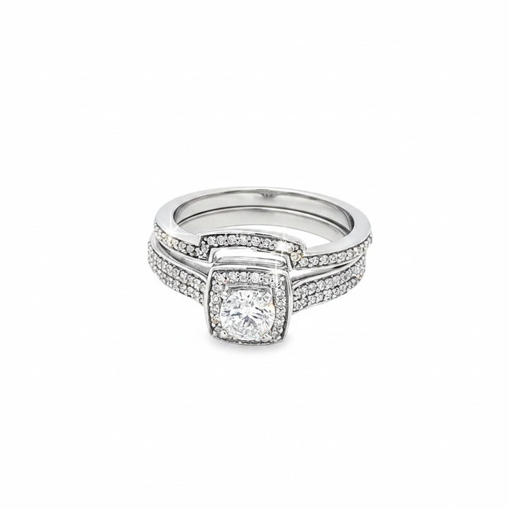 Caribbean Gems 14kt white gold diamond bridal ring set featuring a 0.31ct round cut center stone and diamond accents.