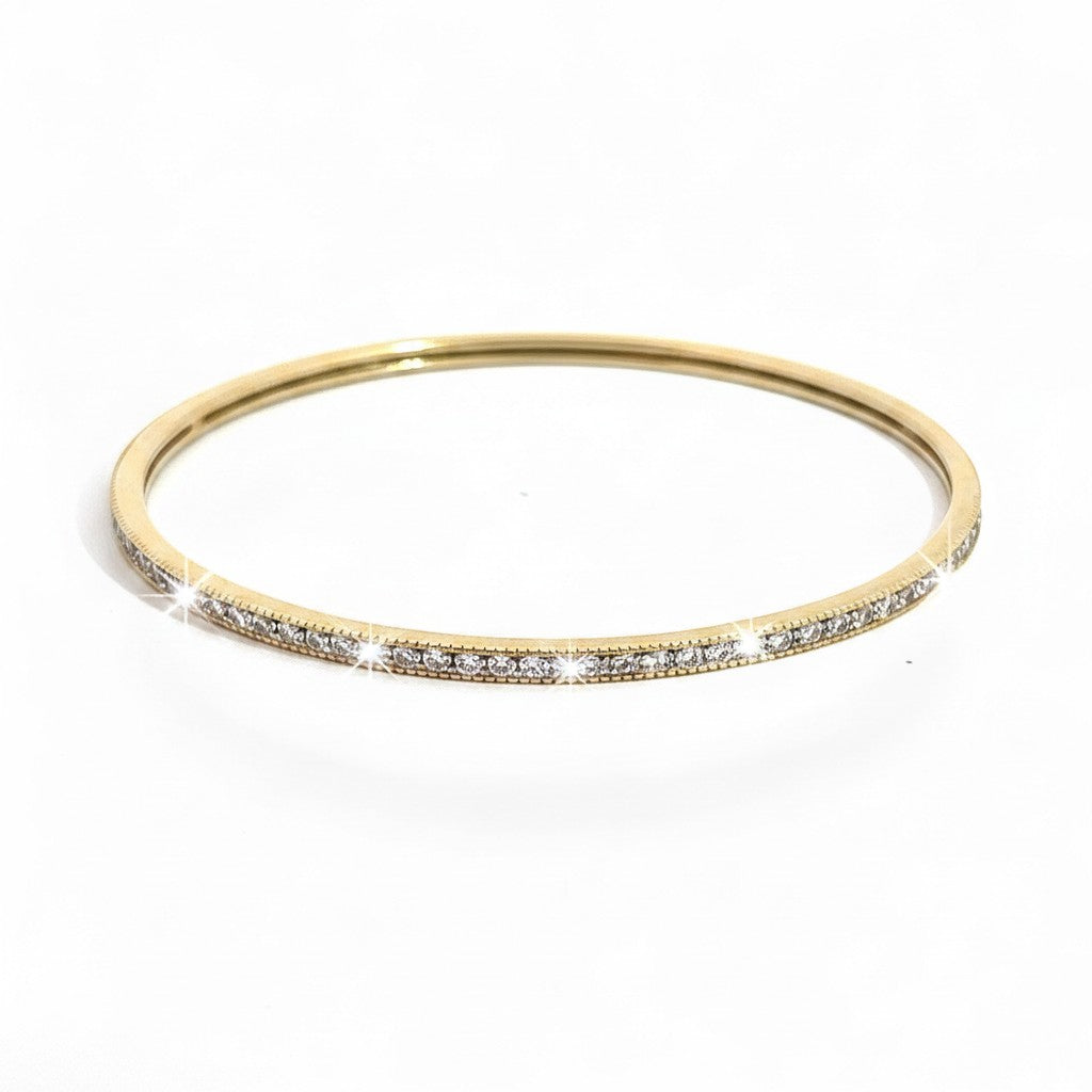 Caribbean Gems ladies 14kt yellow gold bangle featuring 1.50cts of sparkling round yellow diamonds