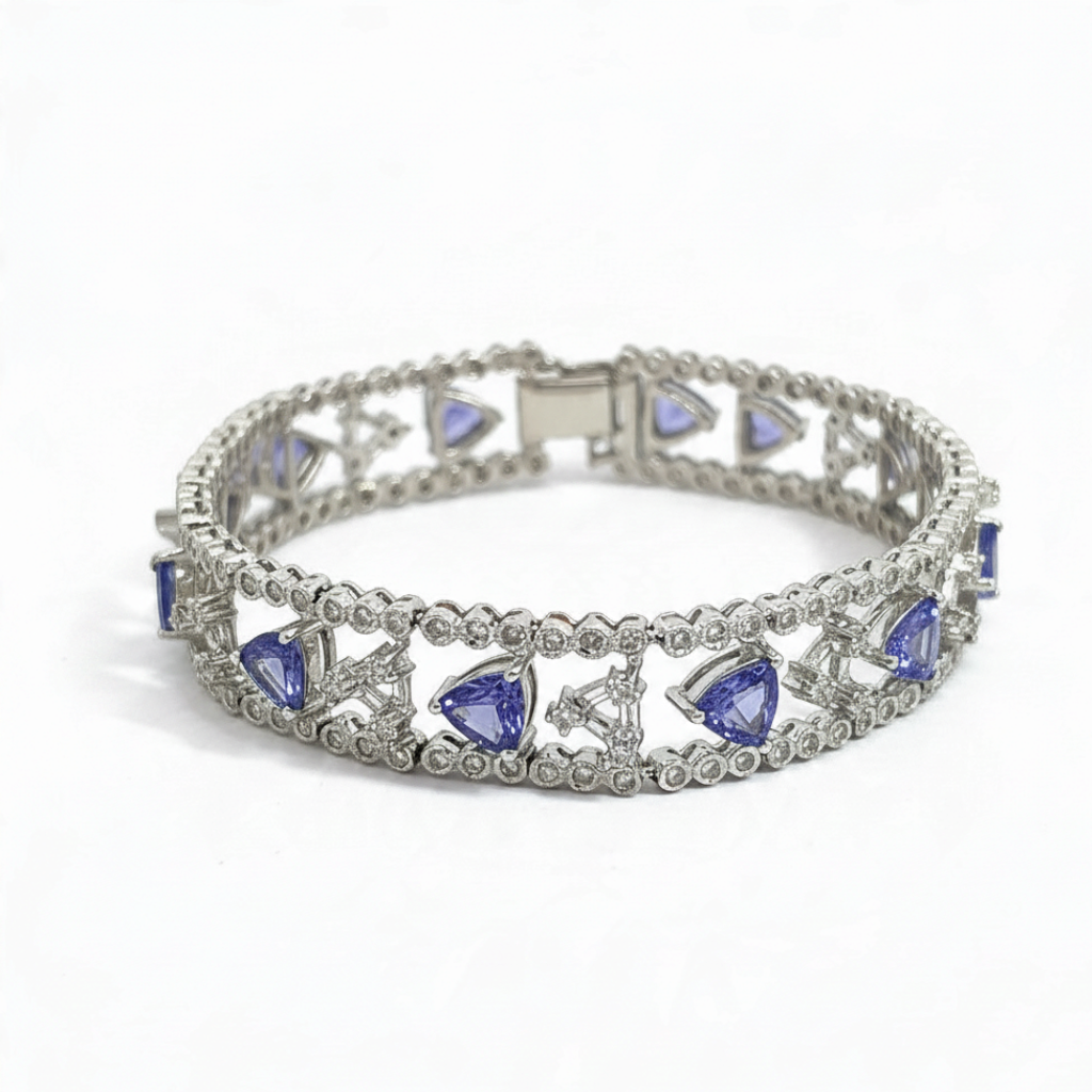 Caribbean Gems 14kt white gold bracelet with triangular tanzanite stones and round diamond accents in a filigree design